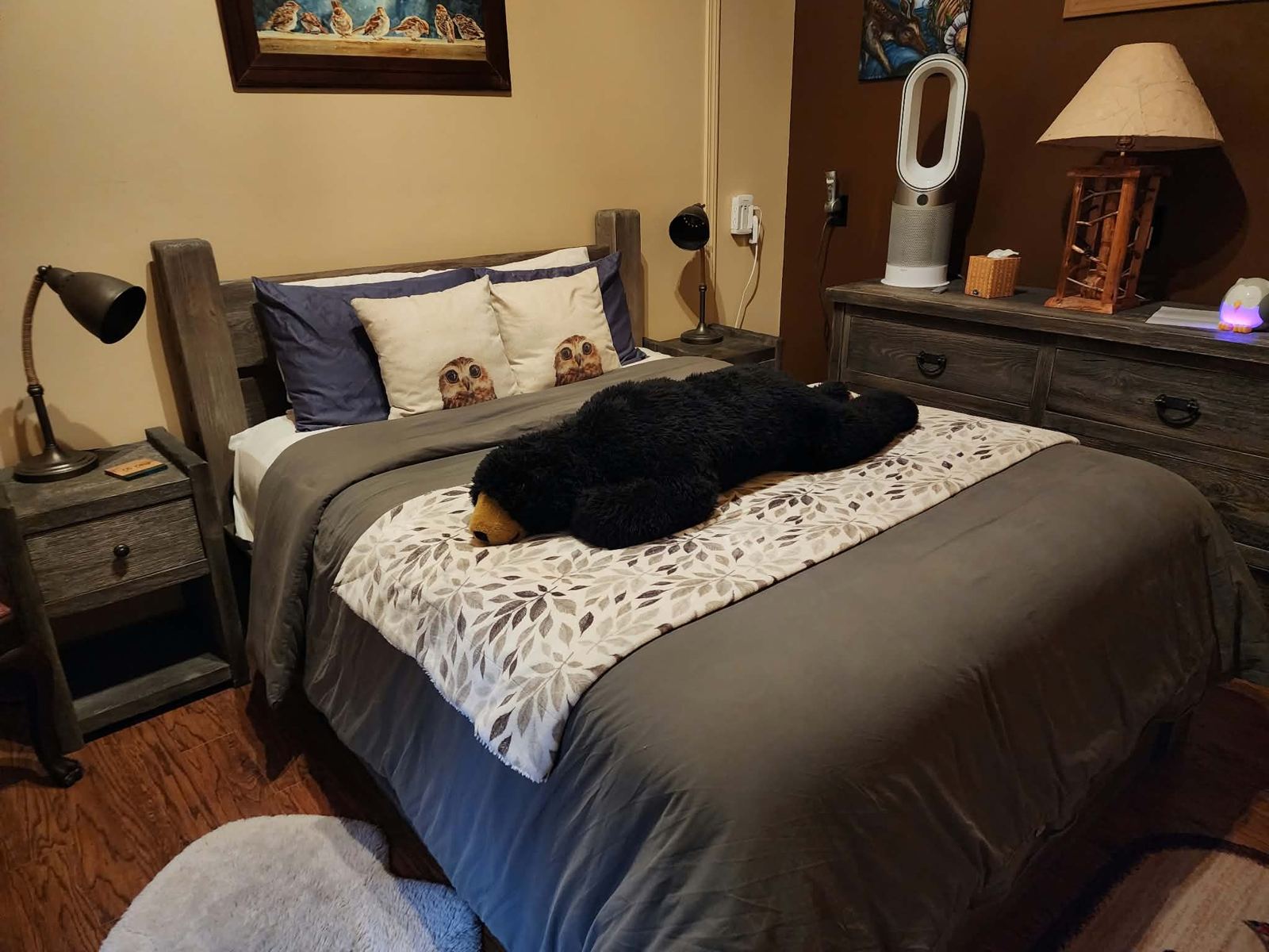 Made bed with a plush bear
